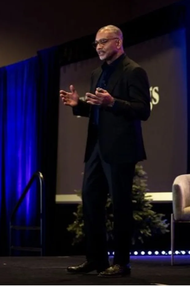 Dr. Don Buford presenting on stage at an orthobiologics course