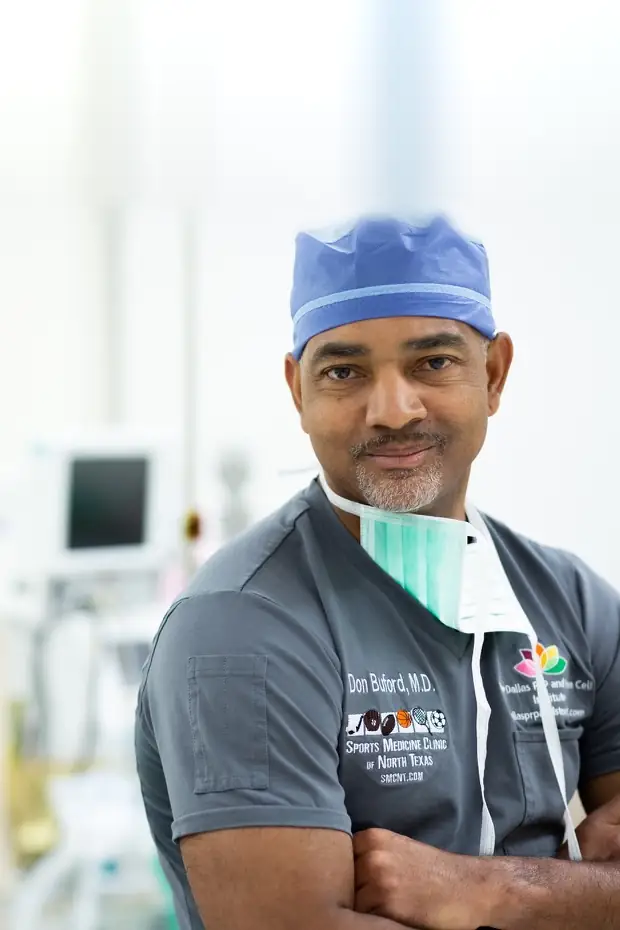 Don Buford, M.D. in surgical scrubs in the operating room