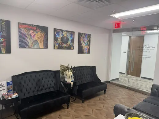 Texas Orthobiologics waiting room and etched glass entry door in Suite 202